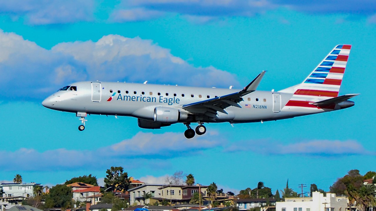 An American Eagle Embraer jet lands at San Diego International.